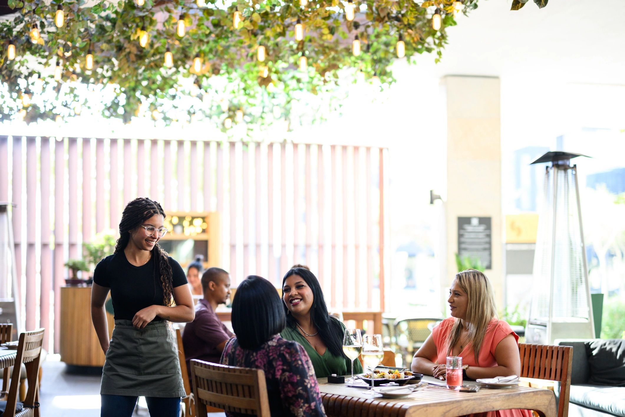 Outdoor Italian-style lunch gathering on a terrace